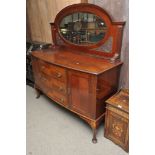 A mahogany sideboard with raised mirrore