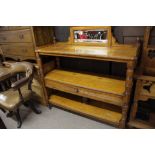 An oak buffet with open shelves and turn