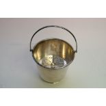 A silver plated ice bucket having inner