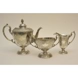 An ornate silver plated three piece tea