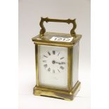 A brass cased carriage clock with a rect