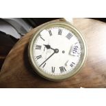 A brass cased ships clock the dial with