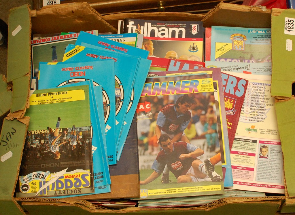 A box of football programmes including A