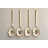 A set of four silver teaspoons having en