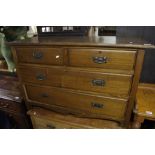 An oak chest of drawers