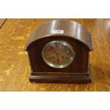 A mahogany mantel clock the arch shaped