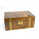 A walnut brass bound writing box