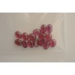 A collection of fifteen oval shaped ruby