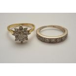 Two ladies gold rings comprising a diamo