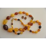 A graduated amber necklace of varying co