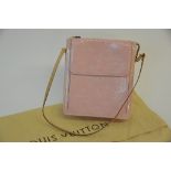 A ladies Louis Vuitton Vernis baby pink