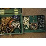 A jewellery box containing various costu