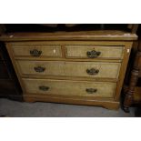 A satin walnut chest of drawers