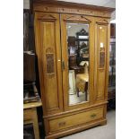 An Edwardian satin walnut wardrobe