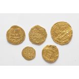 A collection of five Islamic gold coins