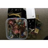 A box of various costume and dress jewel