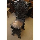 A continental carved hall chair