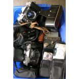 A box containing various cameras includi