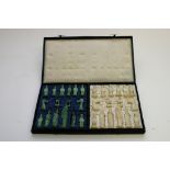 A cased Chinese soapstone chess set