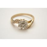 A ladies 9ct gold diamond cluster ring