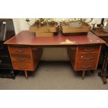 A 1950's mahogany office desk with simul