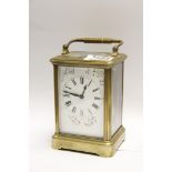 A brass cased carriage clock the dial de