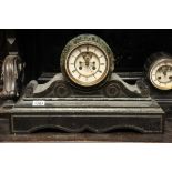 A black slate and marble mantel clock wi