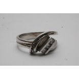 A 14ct white gold ring of modern design