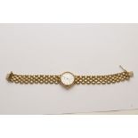A ladies 9ct gold wristwatch, the dial h