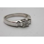 An 18ct white gold ring of modern design