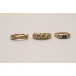 Three nine carat gold rings inset with c
