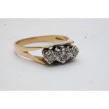 A ladies 18ct yellow gold diamond trilog