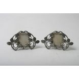 A pair of small silver Art Nouveau style photo frames