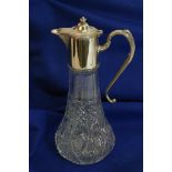 A cut glass claret jug with moulded work,