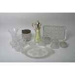 Two glass dressing table sets, a claret jug,