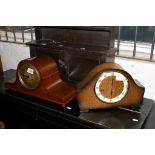 A mahogany mantle clock with another of oak