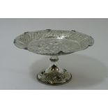 A silver plated tazza with impressed decoration of fruit.