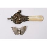 A silver child's rattle with Chester hallmarks and a silver butterfly brooch (2)