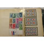 An old stamp album of USA stamps to $5 mint togeter with Swiss pro Juventate stamps