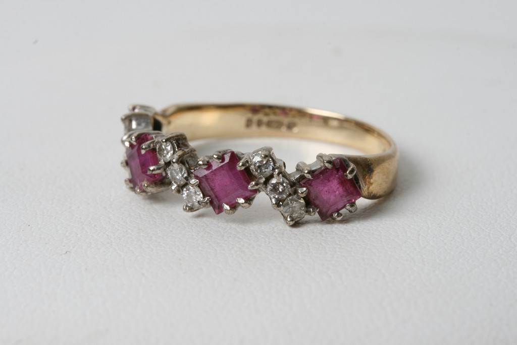 A 9ct gold ruby and diamond ring with alternating stones