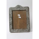 A large silver mounted photo frame