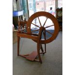 withdrawn - A reproduction spinning wheel.