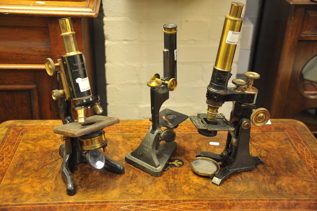 A collection of 3 microscopes including W Watson & Son