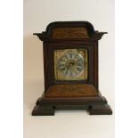 An inlaid Mahogany continental mantel clock.