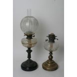 Two Victorian oil lamps one with an original acid etched shade