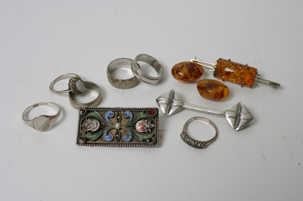 A small bag of silver jewellery including six rings,