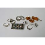 A small bag of silver jewellery including six rings,