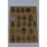 A collection of 23 various Glengarry badges and various others,