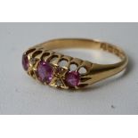 An 18ct gold ring inset with Ruby's and chip diamonds