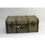 A vintage trunk containing a collection of household cavalry items comprising gloves,